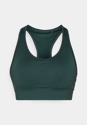 Soutien-gorge de sport vert foncé avec un design dos croisé, texture lisse et large bande à la base. Pas de matériel ou motifs visibles.