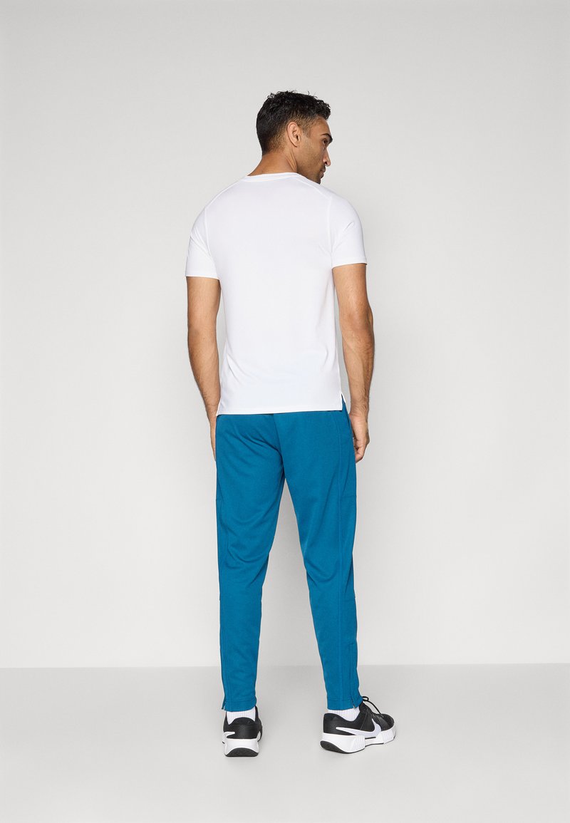 Nike Performance HERITAGE - Teplákové kalhoty - blue force
