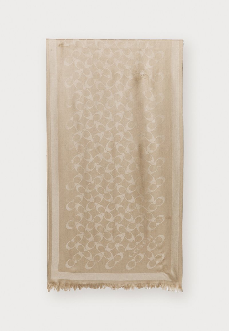 Beżowy szalik z fakturowanym wzorem splecionych kółek, frędzlami na krawędziach i subtelnym logo u dołu. Gładki, lekki materiał.