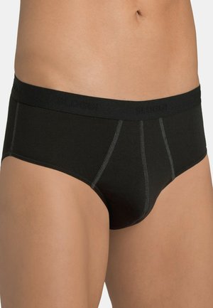 Male torso wearing black briefs with visible stitching and a branded waistband, set against a plain background.