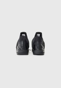 adidas Sportswear UNISEX - Pārgājienu apavi - core black/black reflective/semi lucid red
