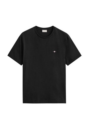 Schwarzes T-Shirt mit kurzen Ärmeln und Rundhalsausschnitt, mit kleinem, auf der linken Brust aufgesticktem GANT-Logo.