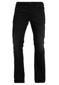 Svarta denimjeans med rak passform, med fem fickor, knappgylf och subtila syddetaljer. Slät textur.