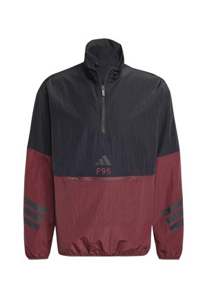 Rompevientos de media cremallera en negro y marrón granate con bolsillo frontal, puños elásticos, logo de Adidas, texto "F95" y tres rayas negras en las mangas.