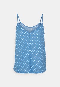 Haut sans manches bleu en V, avec des pois blancs, des boutons recouverts de tissu à l'avant et des fines bretelles réglables.