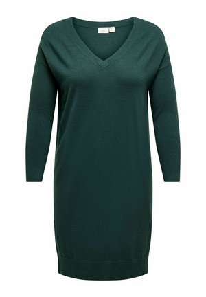 Donkergroene jurk met lange mouwen en V-hals, gemaakt van zachte stof. Kenmerkt zich door een relaxte pasvorm en een geribbelde zoom voor extra textuur. Eenvoudig ontwerp.
