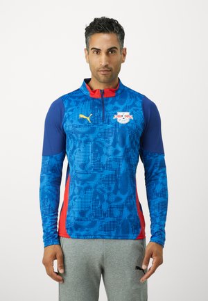 Blauwe en rode sportshirt met lange mouwen, voorzien van een textuurpatroon, een halve rits kraag en het Puma-logo; gemaakt van vochtafvoerende materialen.