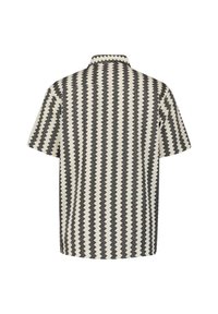 Korte mouwen shirt met een zigzagpatroon. Gemaakt van geweven stof in crème en zwart. Beschikt over een kraag en een rechte zoom.