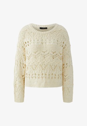 Pull tricoté couleur crème avec des motifs ajourés complexes et des manches longues, doté d'un col rond et de poignets côtelés.