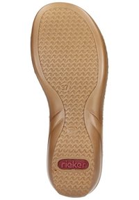 Brązowa gumowa podeszwa buta z teksturowanym wzorem fal, z wytłoczonym logo i rozmiarem "37", zaokrąglone krawędzie i płaski design.