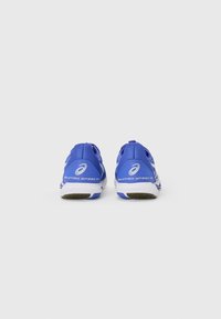 Blue athletic shoes with a mesh upper and synthetic overlays. Features white accents and textured rubber soles. Low-profile design.