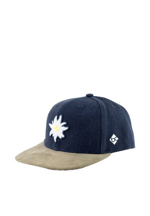 Navy blue cap with beige brim, white embroidered flower with yellow center on front, and small white geometric logo on side.