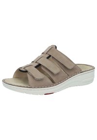 Beige sandal with three adjustable velcro straps, open toe, and cushioned insole. Features a white rubber sole with red accent.