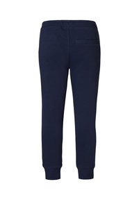 Navyblauwe sweatpants van zacht materiaal, met een tapered leg ontwerp, ribgebreide boorden en een achterzak. Vlotte textuur en duurzame afwerking.