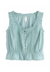 Blouse sans manches bleu clair avec bords à volants, boutons devant, lien au niveau de l'encolure et détail élastique à la taille.