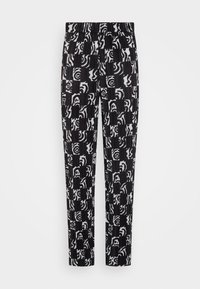 Czarno-białe spodnie w wzory z mieszanką abstrakcyjnych kształtów i pasków. Posiadają elastyczny pas i prostą nogawkę.