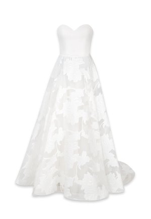 Strapless white wedding gown with fitted bodice and full skirt featuring sheer floral lace overlay and slight train.