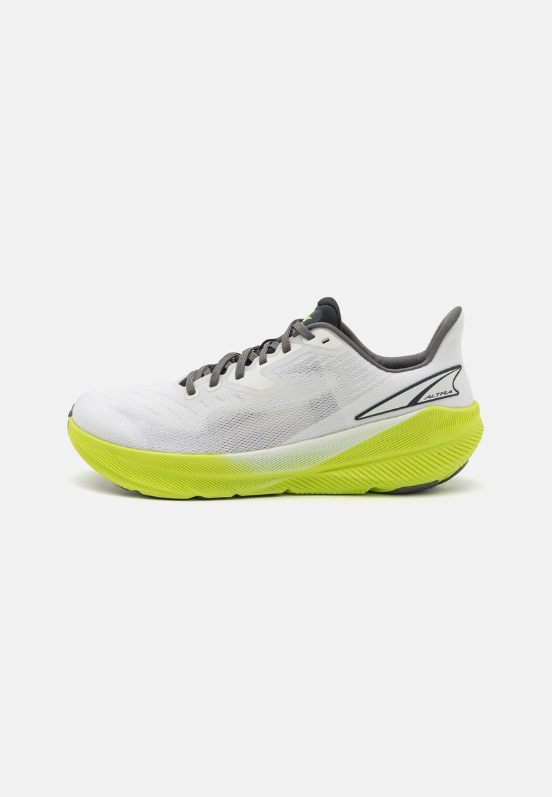 White athletic shoe with a textured mesh upper, gray laces, and a bright yellow sole featuring a pronounced, curved design.