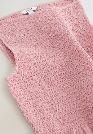 Rozā bezroku tops no teksturētas auduma, ar savākta dizainu un smalku viļņotu efektu, kā arī etiķeti ar uzrakstu "NEXT".