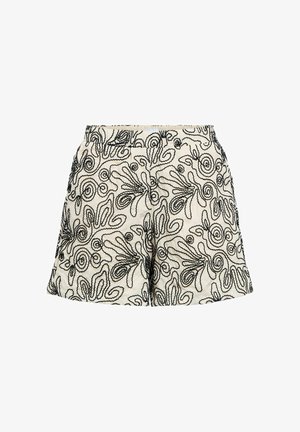 Shorts blancs avec motifs abstraits en lignes tourbillonnantes noires, ceinture élastique et coupe ample.