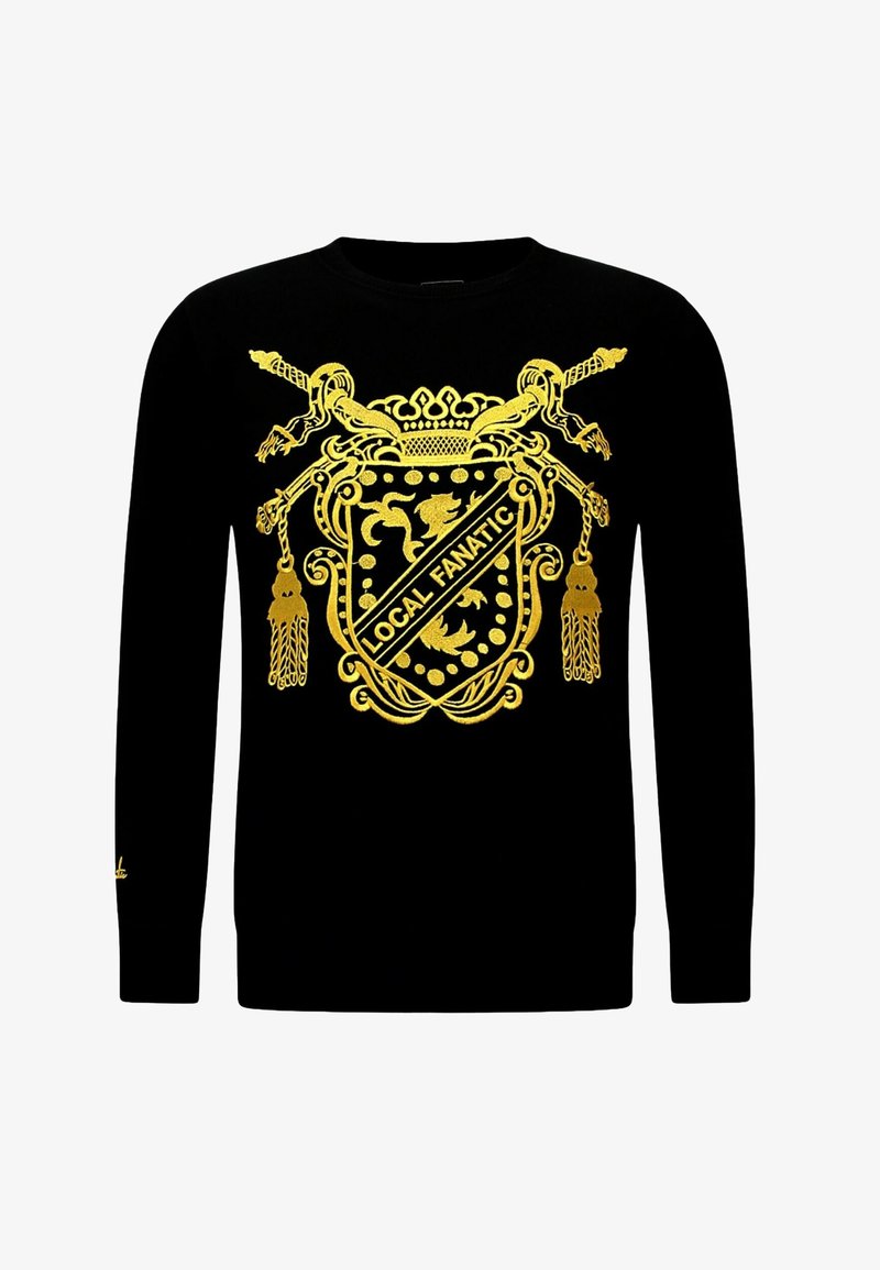 Zwarte sweatshirt met een goudkleurig schildontwerp en de tekst "LOCAL FANATIC", met fijne details en lange mouwen. Zachte textuur.