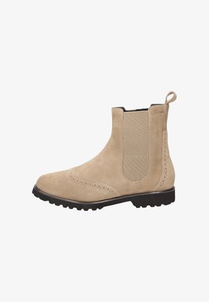 Bottine en suède beige avec des panneaux latéraux élastiques, des détails en brogue et une semelle en caoutchouc texturée. Comprend une languette pour un enfilage facile.