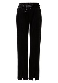 Zwarte corduroy broek met een zachte textuur, elastische tailleband en trekkoorddetail. Heeft zijsplits aan de onderkant voor extra stijl.