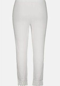 Pantalons blancs ajustés avec une taille élastique et une bordure en dentelle décorative au bas, texture lisse et longueur au milieu du mollet.