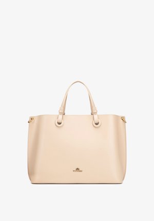Beige leren totebag met twee handvatten, gouden ringen aan de zijkanten en klein goudkleurig merkembleem gecentreerd aan de voorkant.