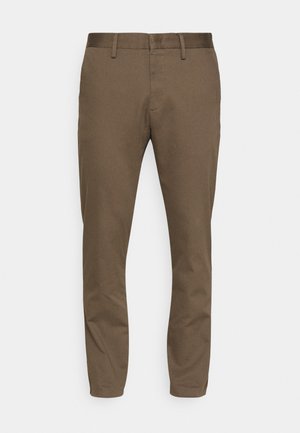 Brune, stretch-stoffbukser med slim fit. Har en glatt midjebånd, belteholdere og to frontlommer.