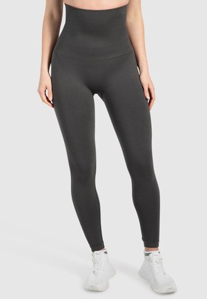 Hoge taille, strakke leggins in donkergrijs, gemaakt van soepele stretchstof, met een naadloos ontwerp voor comfort en bewegingsvrijheid.