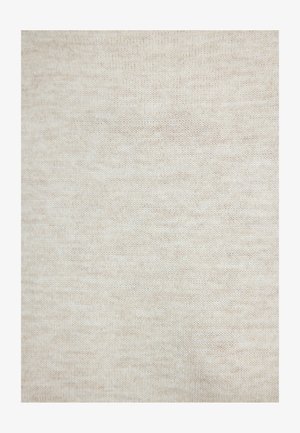 Gros plan sur un tissu beige tricoté avec des points fins et réguliers, montrant une texture douce et des variations subtiles de couleur.