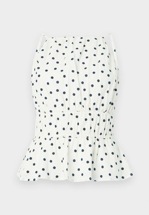 Biely top s námorníckymi bodkami, s naťahovacím pásom a rozšíreným lemom. Tenké ramenné popruhy dotvárajú dizajn. Ľahký bavlnený materiál.