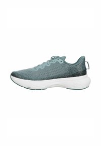Zapatillas deportivas de color azul claro con parte superior de malla, puntera redondeada y suela blanca. Presentan un patrón texturizado y una lengüeta en la parte posterior.