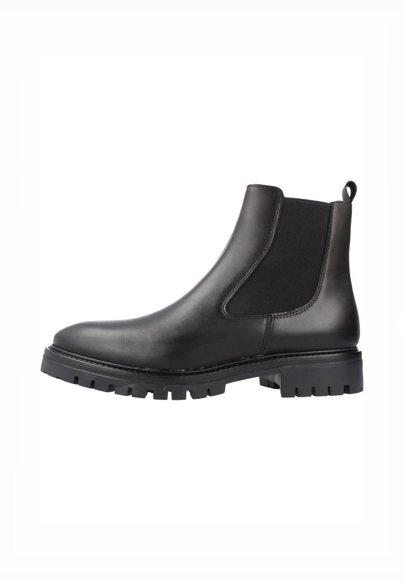 Bota Chelsea de cuero negro con paneles laterales elásticos, un ligero tacón y una suela de goma resistente con profundos surcos para tracción.