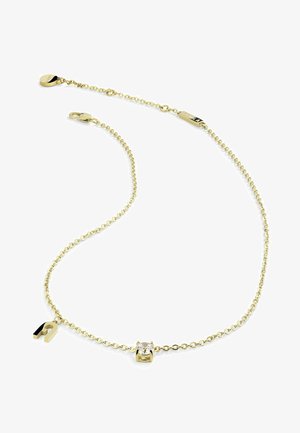 Goldene Halskette mit einem runden klaren Edelstein in einer vierzinkigen Fassung und einem kleinen magnetischen Charme als Akzent. Die Kette hat ein zartes Gliederdesign.