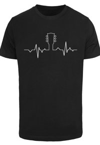 Black t-shirt featuring a white graphic of a guitar silhouette integrated with a heartbeat line, creating a smooth, continuous design.