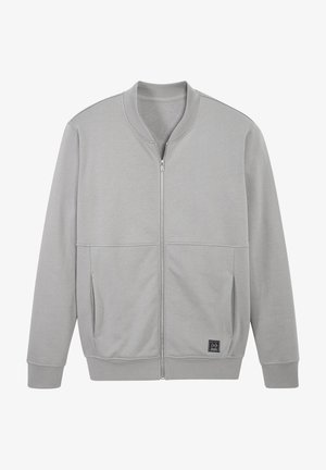 Light grey zip-up jacket with ribbed collar, cuffs, hem, side pockets, and a small black square logo patch on front lower side.