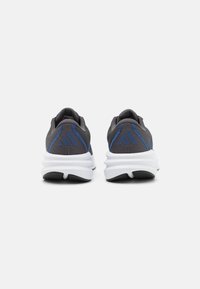 Gray athletic shoes with blue accents, mesh upper, padded collar, thick white midsole, and textured black outsole.