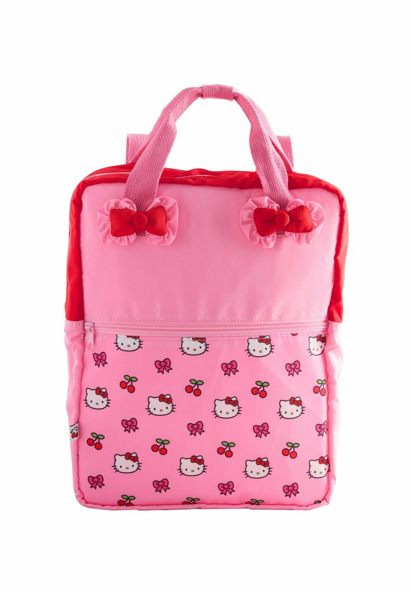Sac à dos pour enfants rose avec des nœuds rouges sur les bretelles, poche avant ornée de visages de Hello Kitty, de nœuds roses et d'un motif de cerises rouges.