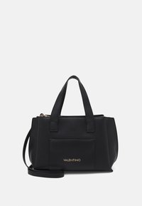 Black leather handbag featuring a textured finish, dual top handles, a detachable shoulder strap, and a front pocket with gold logo accents.