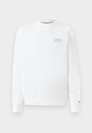 Λευκή φούτερ μπλούζα με μακριά μανίκια και στρογγυλή λαιμόκοψη, με μικρό τυρκουάζ λογότυπο "Tommy Hilfiger" στο στήθος και μικρό έμβλημα με τη σημαία στον αριστερό καρπό.