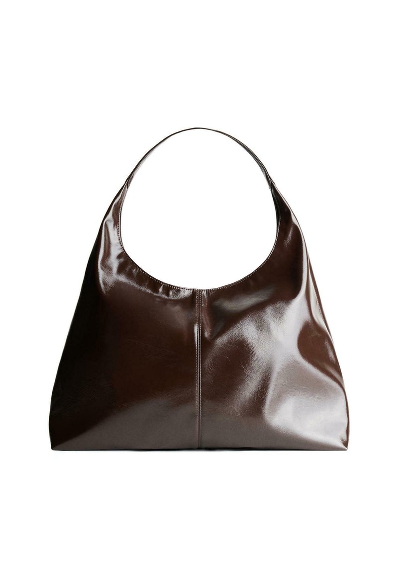 Brown leather hobo bag with a rounded top, smooth texture, and subtle seam details. The strap is wide and curved for comfort.