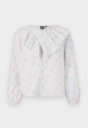 Balta blūze ar viļņotu kakla izgriezumu, ziedu rakstu rozā un zilā krāsā, garām piedurknēm un pogu aizdari priekšpusē. Viegls, teksturēts audums.