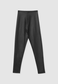 Leggings neri realizzati in un tessuto morbido e elastico, con un design aderente e una vita elasticizzata, senza cuciture visibili o decorazioni.