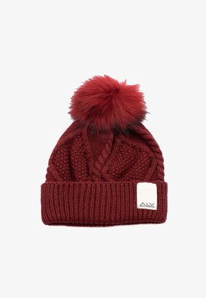 Cappellino lavorato a maglia di colore rosso scuro con motivo strutturato, ampia bordatura a coste e un soffice pompon sulla sommità. Include un piccolo etichetta bianca.