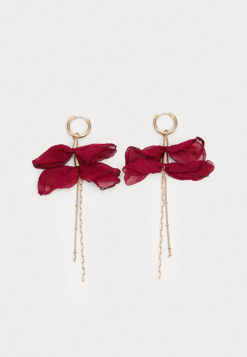 Gold hoop earrings with layered sheer burgundy fabric petals and delicate gold chain dangles on white background.