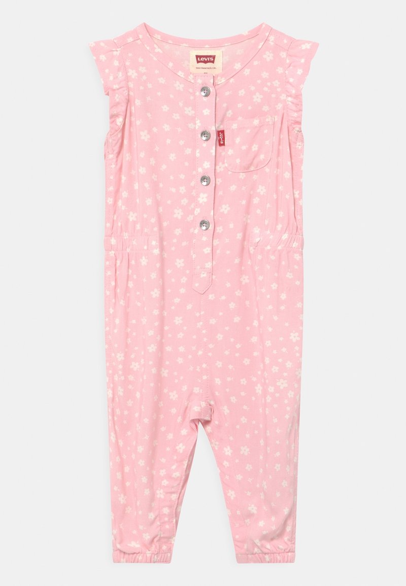 Barboteuse bébé rose sans manches avec imprimé floral blanc, boutons sur le devant, poche poitrine, et taille et ourlets des jambes élastiqués.