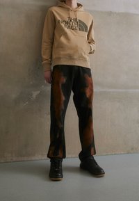 The North Face Jersey con capucha - sand