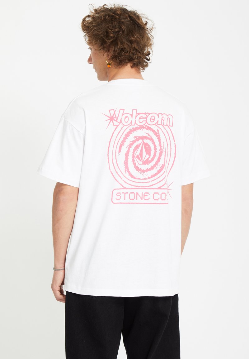 White cotton t-shirt featuring a large pink graphic on the back, including text and a spiral design. Short sleeves and relaxed fit.